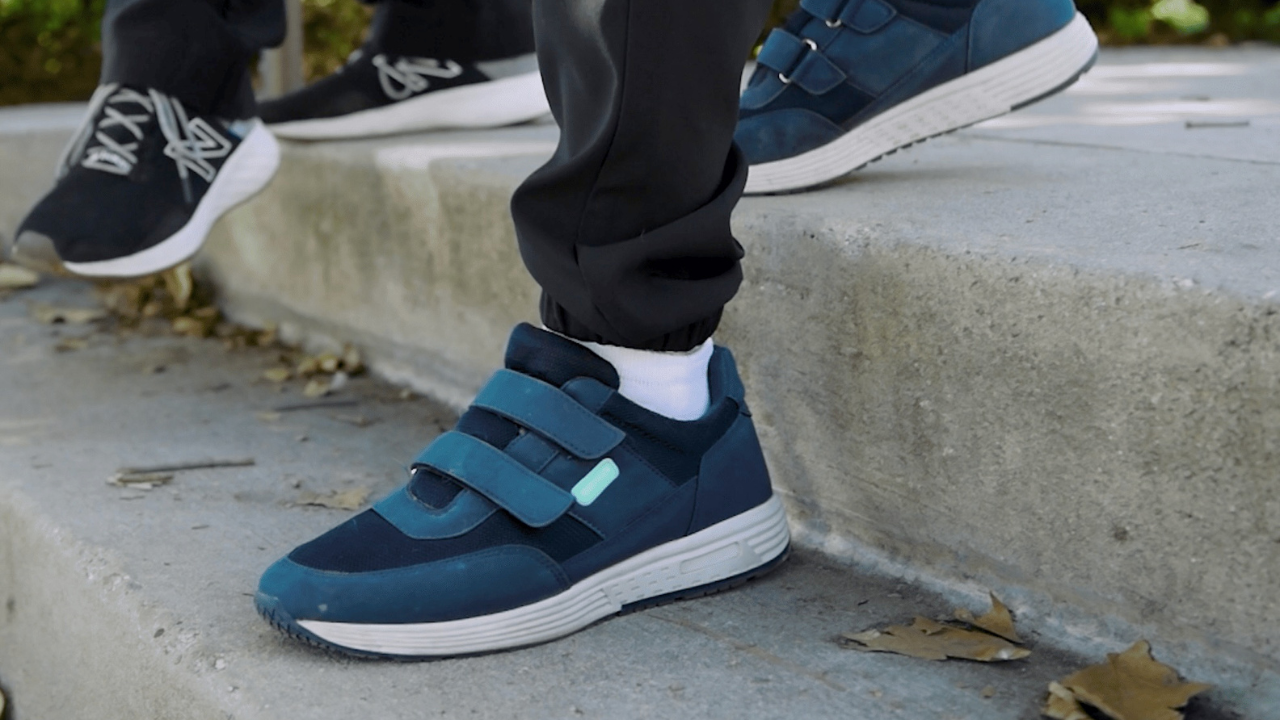 NUSHU smart shoes helping a Parkinson’s patient walk with stability.